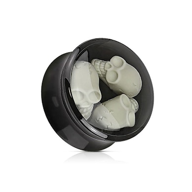 Plugs no akrila ar trīs galvaskausiem