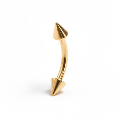 Izliekts stienītis ar zelta pārklājumu un dzeloņveida uzgaļiem