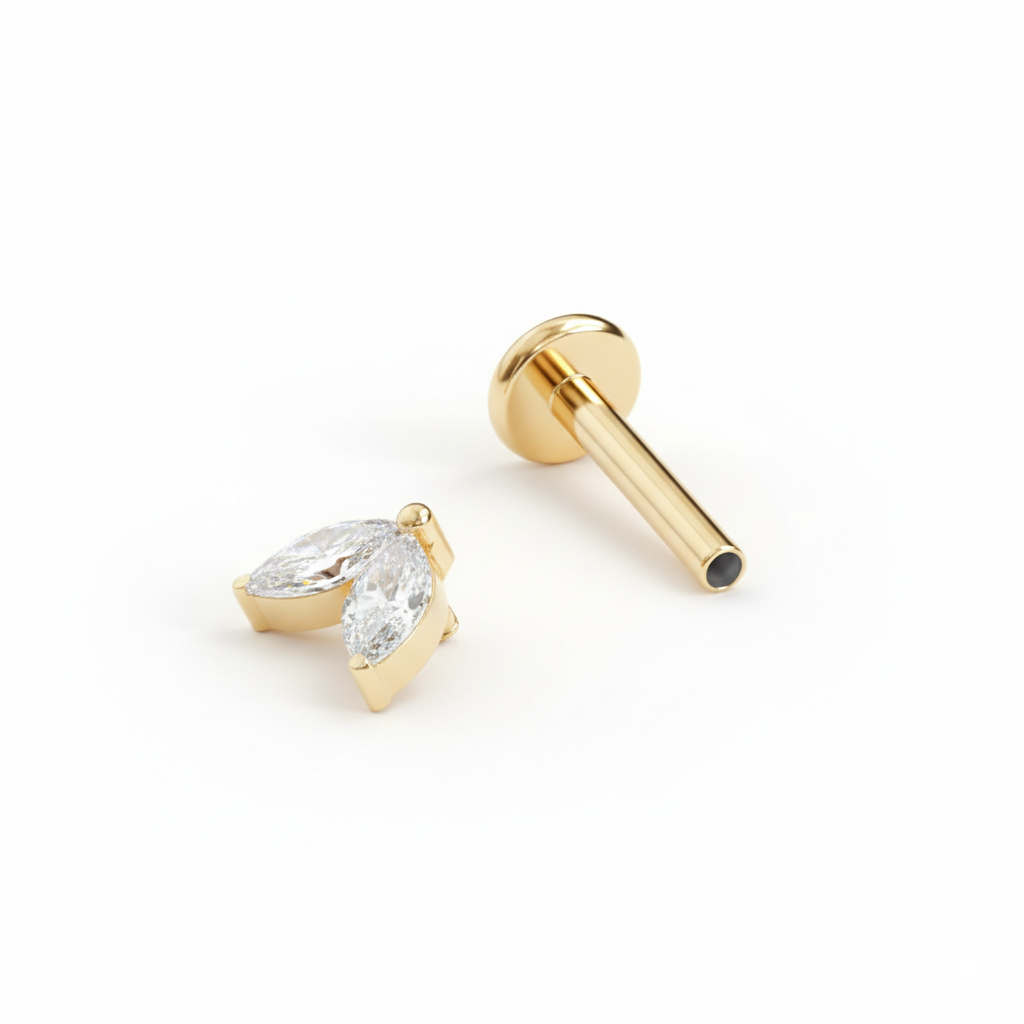 Titāna labrete ar diviem vienādiem akmentiņiem